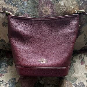 Coach, “JUDE” duffle bag gold/dark wine